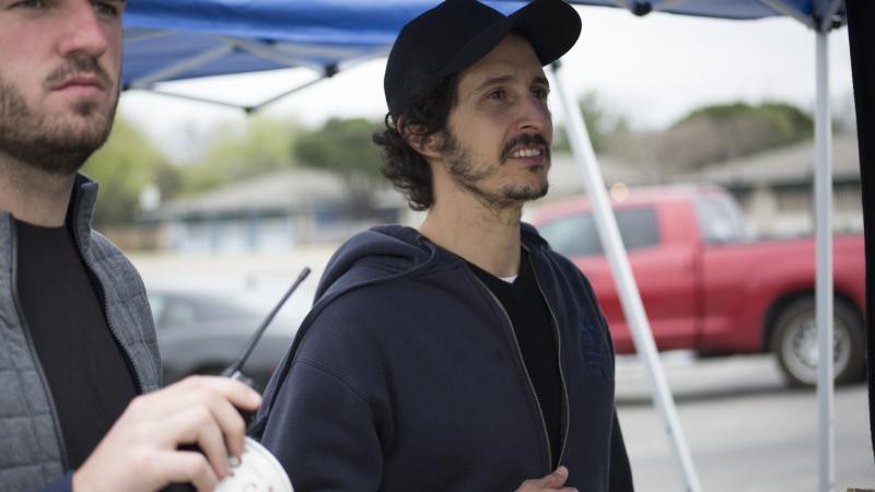 Joel Fendelman and another filmmaker working on set, watching something out of view.