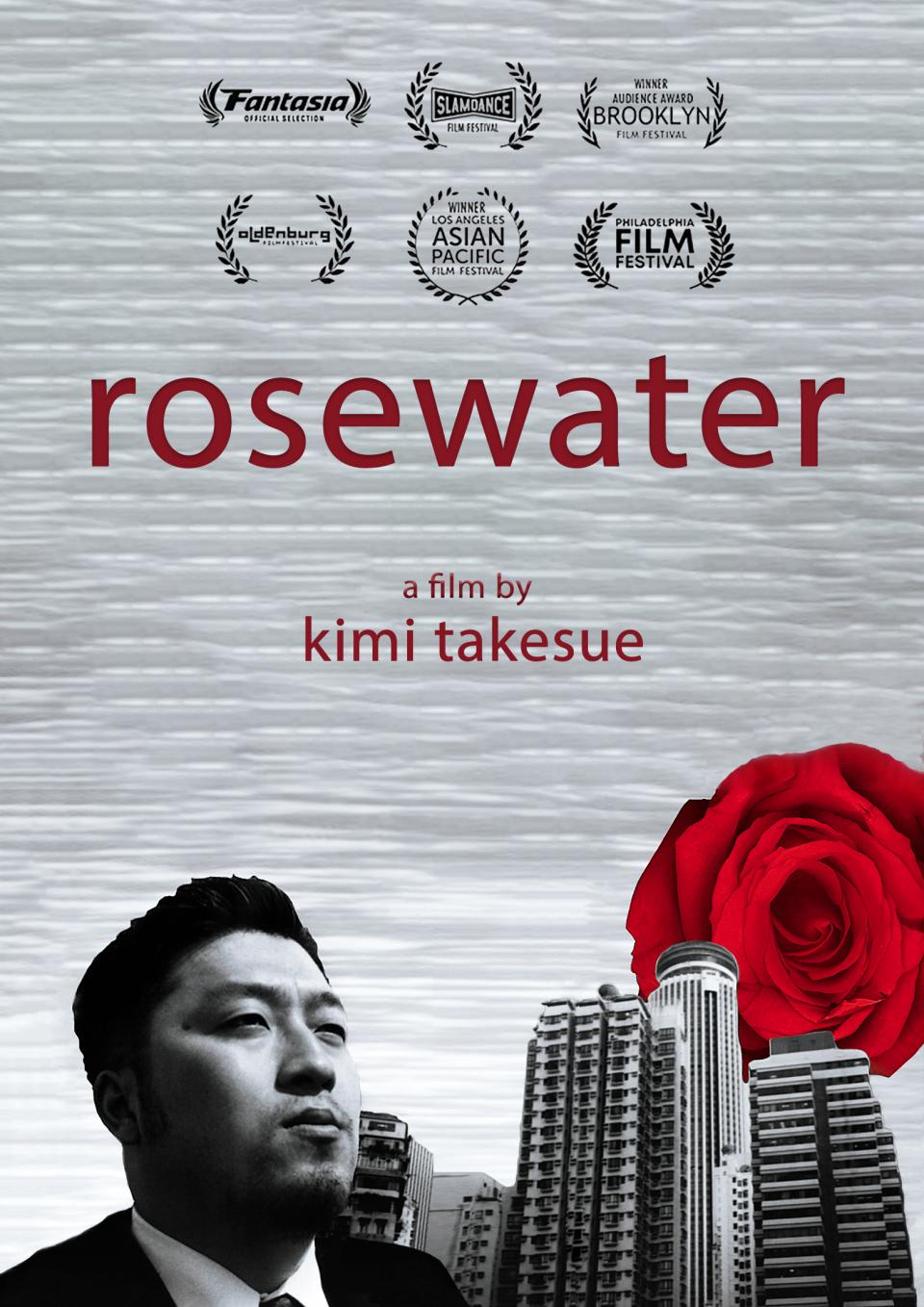 Japanese man stands beside cityscape and a rising rose