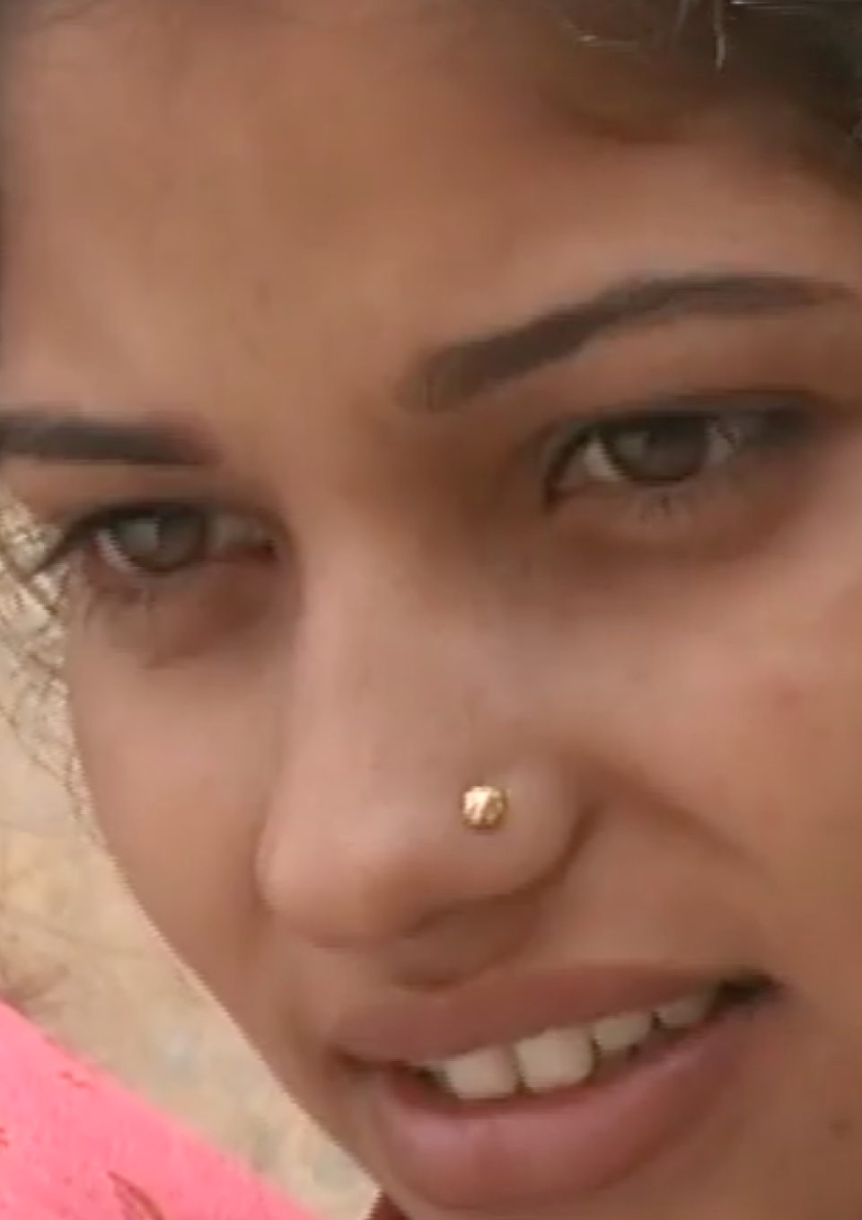 Close-up of Renu, a young Indian woman from Leaving Home.